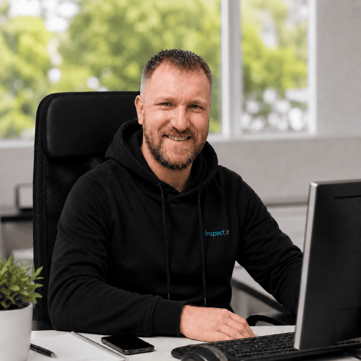 Inspect it team member at his desk