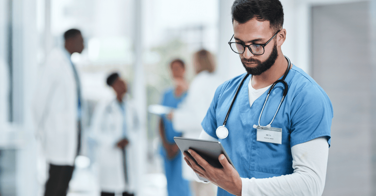 Healthcare professional using a tablet in a hospital